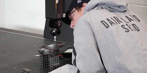 A technician performs an inspection on a Rexroth pump component